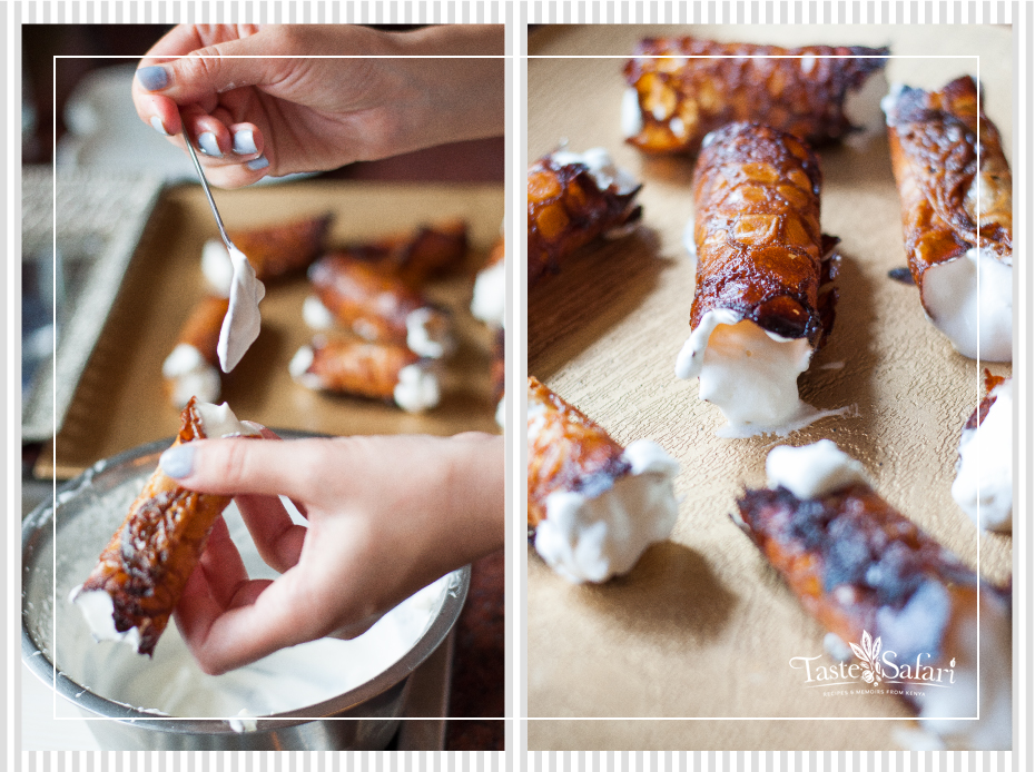 Brandy snaps filled with whipped cream on a plate