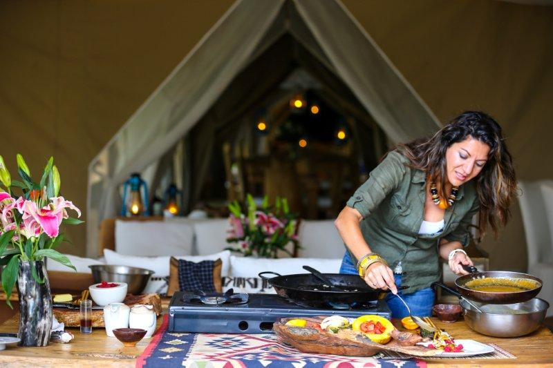 Sandy cooking in a safari tent